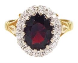 18ct gold oval cut garnet and round brilliant cut diamond cluster ring