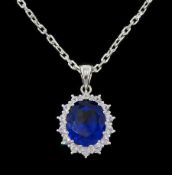 Silver cubic zirconia and blue stone set cluster pendant necklace