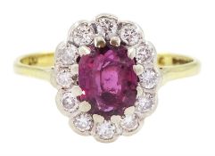 18ct gold oval cut ruby and round brilliant cut diamond cluster ring