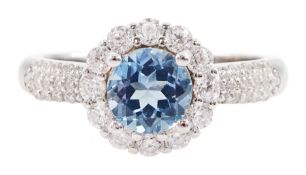 Silver blue topaz and cubic zirconia cluster ring