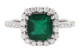 18ct white gold radiant cut emerald and round brilliant cut diamond cluster ring