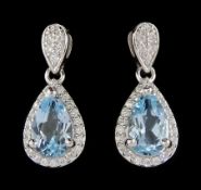 Pair of silver blue topaz and cubic zirconia pendant stud earrings