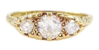 Gold three stone round brilliant cut diamond ring