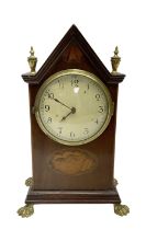 French - Edwardian 8-day mahogany inlaid mantle clock with a gable pediment and brass finials