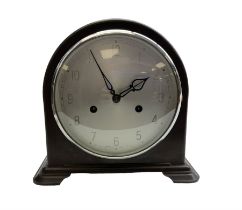 Enfield- English 1950's 8-day mantle clock in a round topped brown Bakelite case on splayed feet