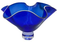 Gillies Jones of Rosedale dark blue glass vase with crimped rim on a short pedestal foot