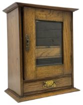 Early 20th oak smokers cabinet with the single glazed door to fitted interior having a single draw a