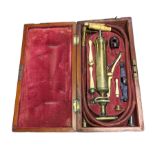 Vintage cased medical pump with bone handles