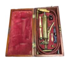 Vintage cased medical pump with bone handles