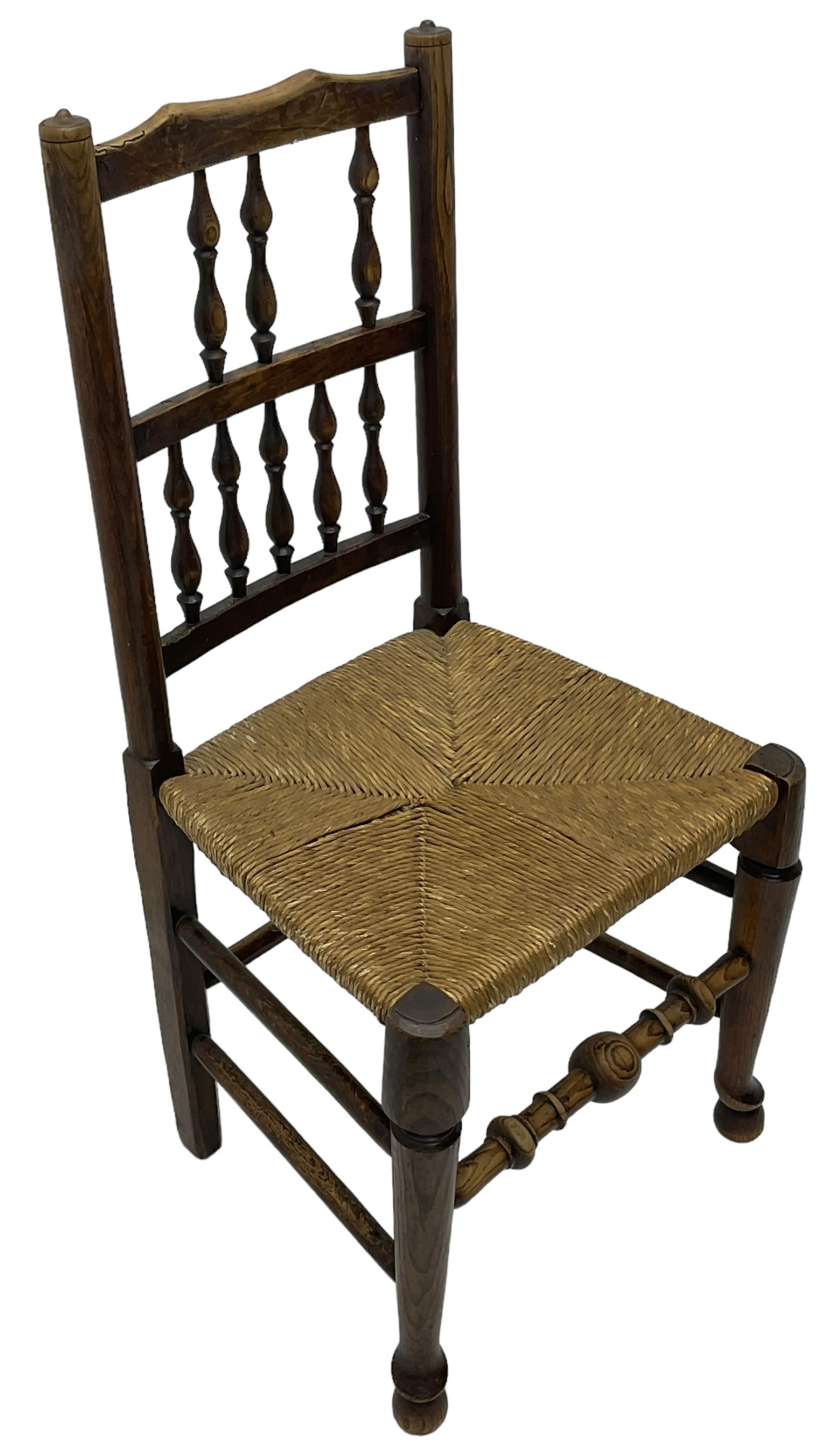 Collection of chairs - five 19th century elm spindle back chairs with rush seats; two chapel chairs - Image 6 of 10