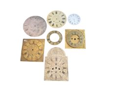 Six clock dials and an engraved brass chapter ring. Comprising of four 18th century brass longcase