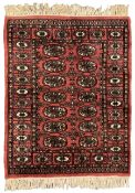 Small peach ground Bokhara rug