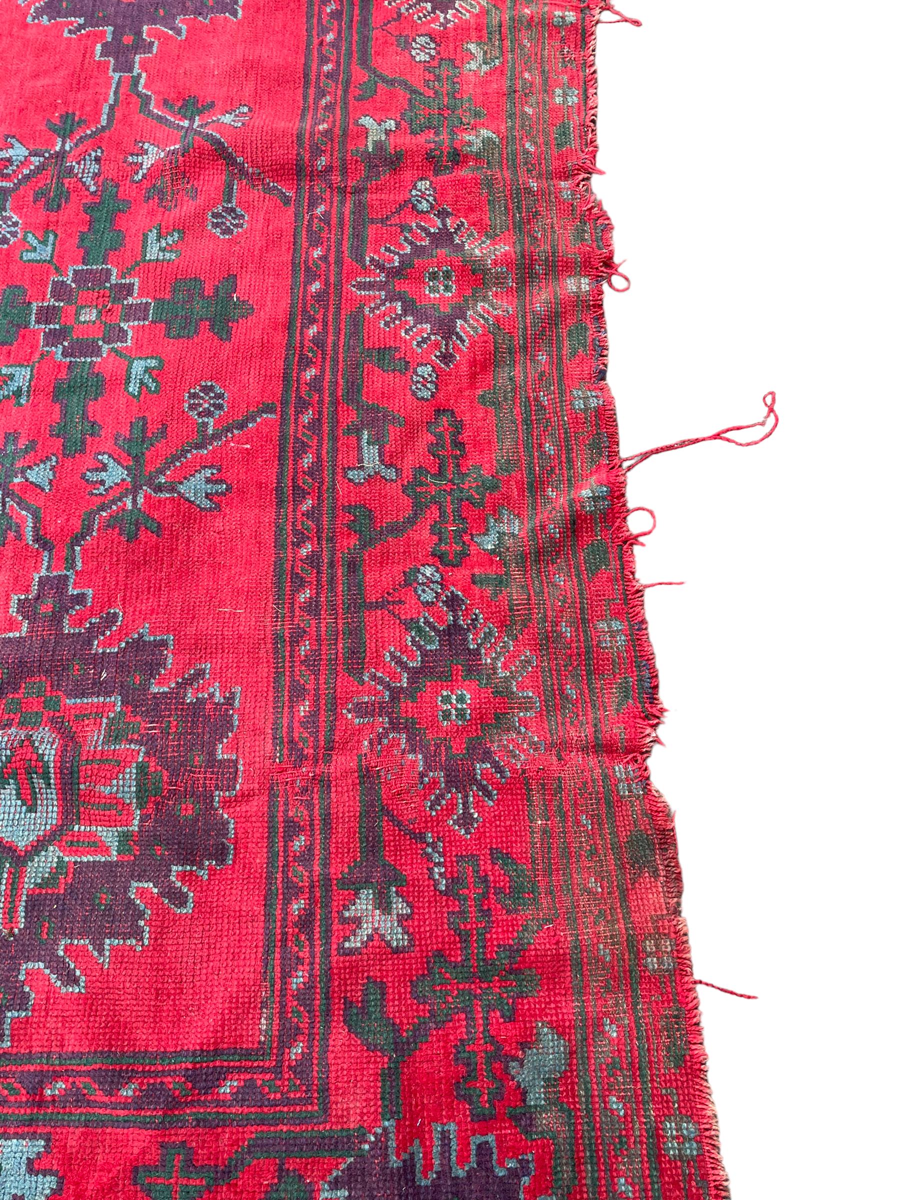 Early 20th century Western Anatolia Turkish Oushak crimson ground carpet - Image 8 of 10