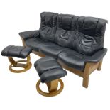 Stressless - 'Buckingham' three-seat settee upholstered in black leather; together with two associat