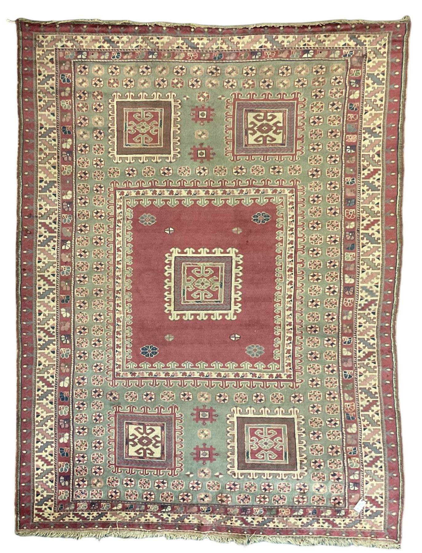 Turkish deep pink and green ground carpet