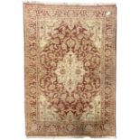 Persian design beige and crimson ground rug