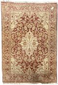 Persian design beige and crimson ground rug