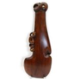 Maori hand club wahaika carved a tiki with inlaid shell eyes