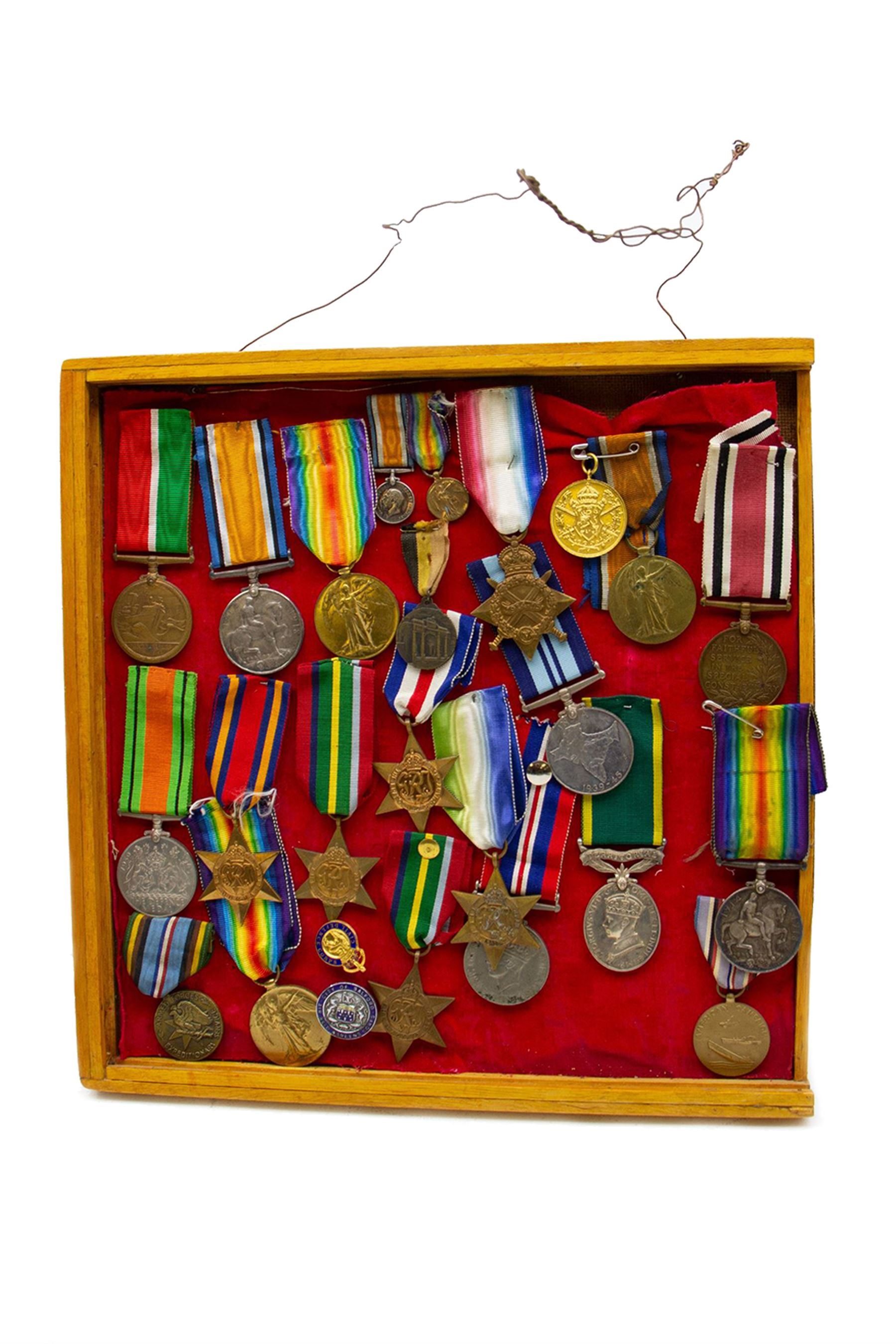Twenty three WWI and WWII medals and miniatures