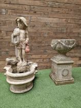 Three section cast stone garden figure of a boy carrying fishing net and a satchel with a water feat