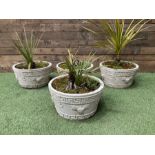 Four cast stone circular planters in white