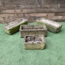 Set of four small carved stone planters