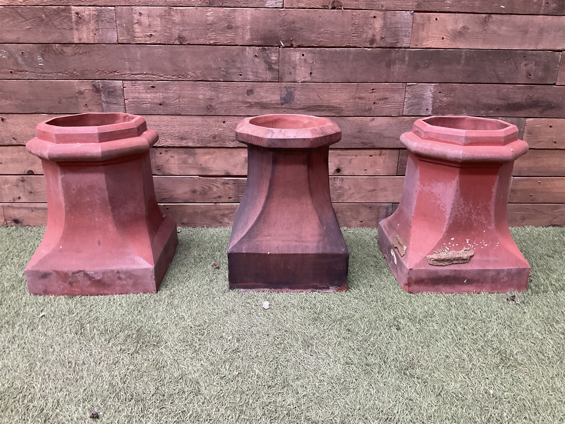 Set of three terracotta chimney pots