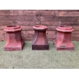 Set of three terracotta chimney pots