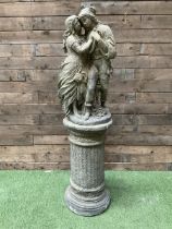 Romeo & Juliet - cast stone garden figure raised on circular fluted column
