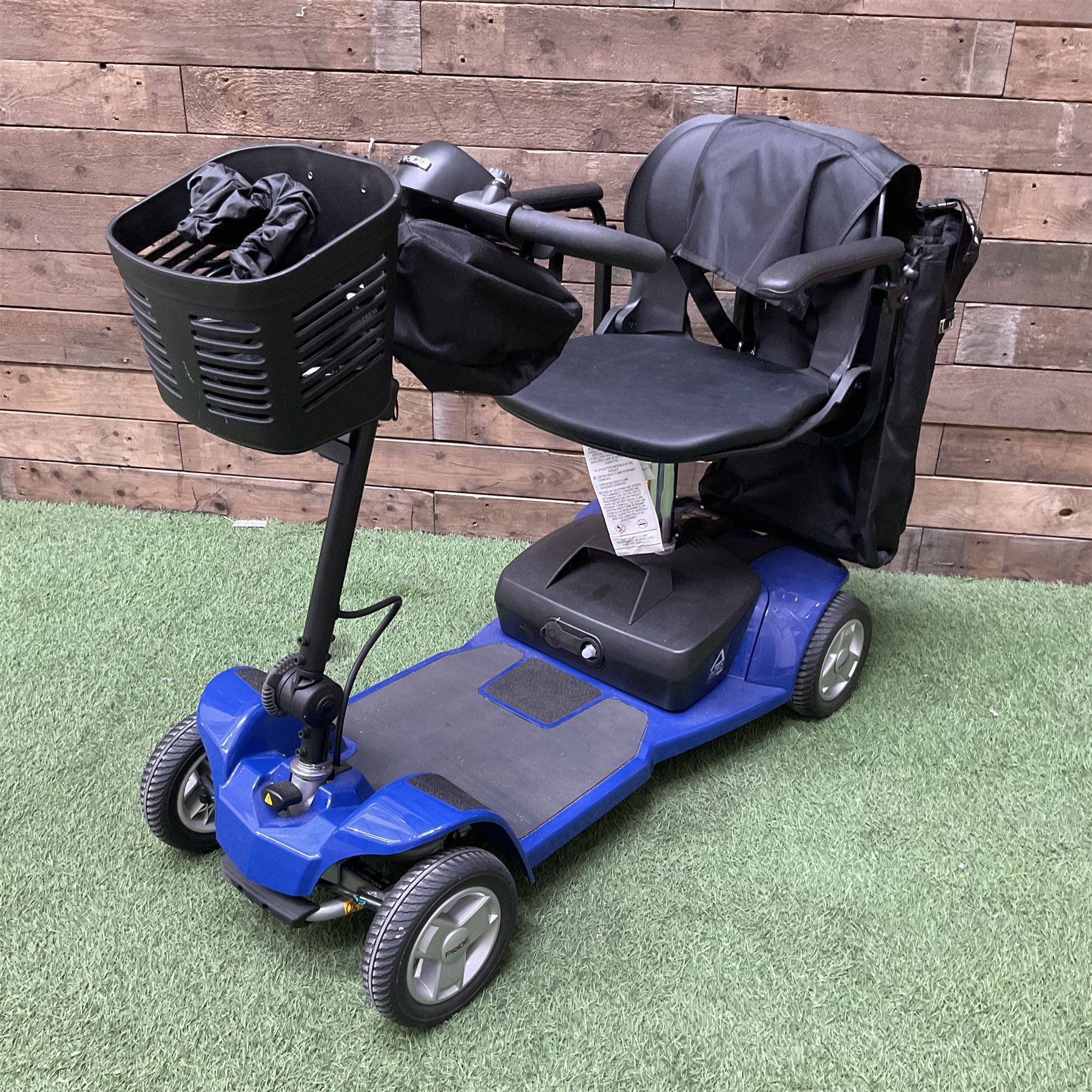 Pride four wheel electric mobility scooter in blue with key and charger