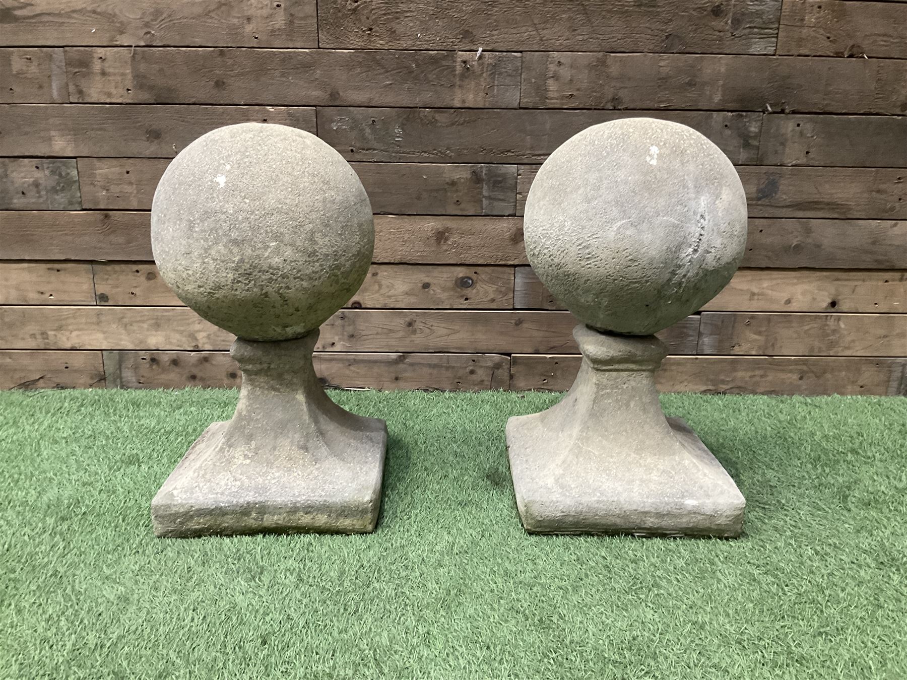 Pair of cast stone garden spherical ball finials or gatepost tops