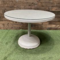 Circular white painted pedestal table with glass top