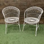 Pair of wrought metal white painted wirework garden chairs