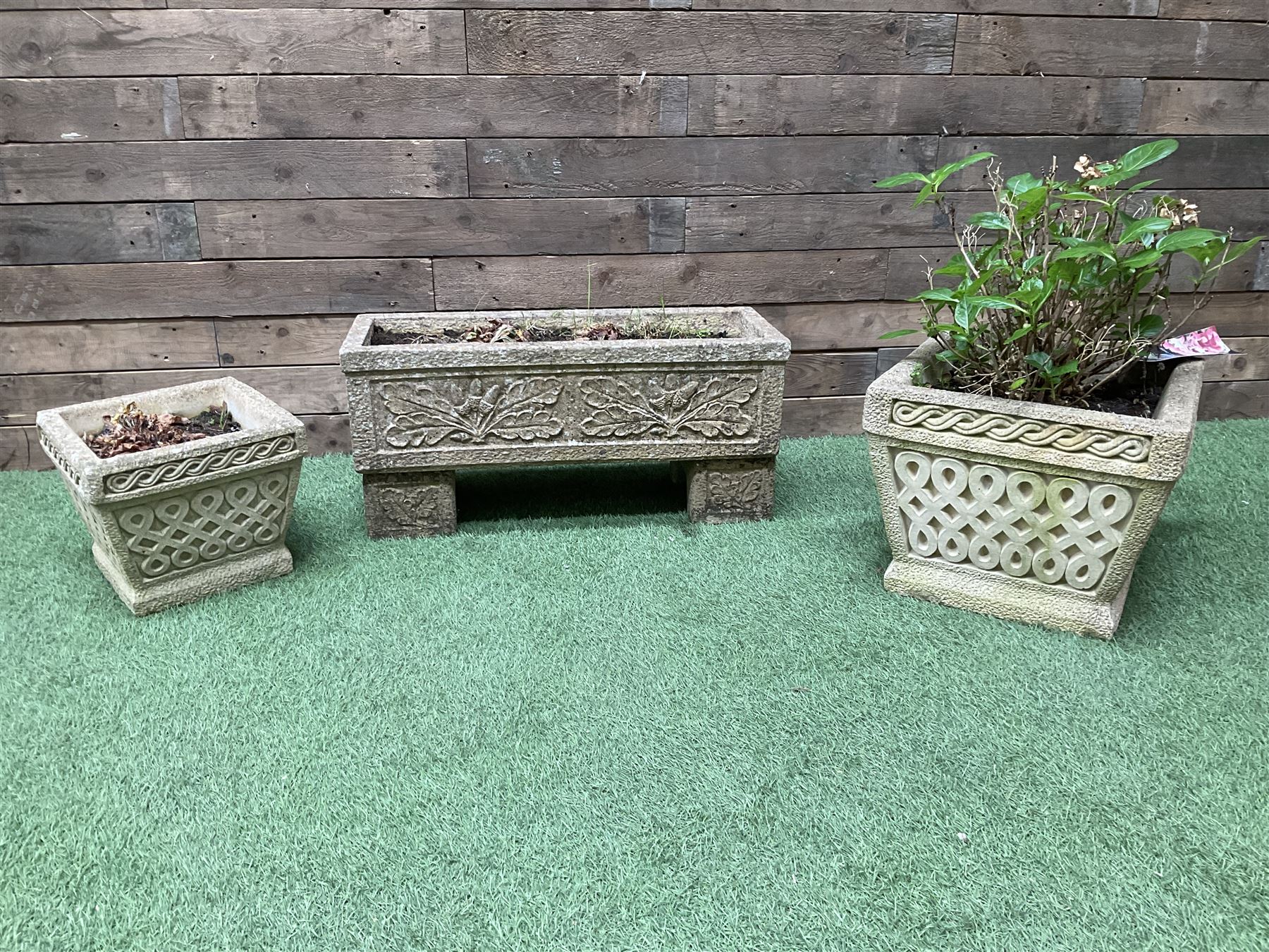 Set of three cast stone garden planters