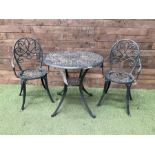 Green painted aluminium circular garden table and two chairs