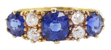 Early 20th century 18ct gold three stone cushion cut sapphire and four stone old cut diamond ring