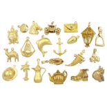 Twelve 18ct gold pendant / charms including horses head