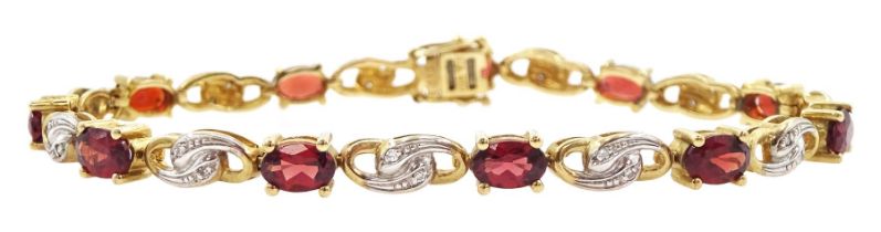 9ct gold oval cut garnet and diamond chip bracelet