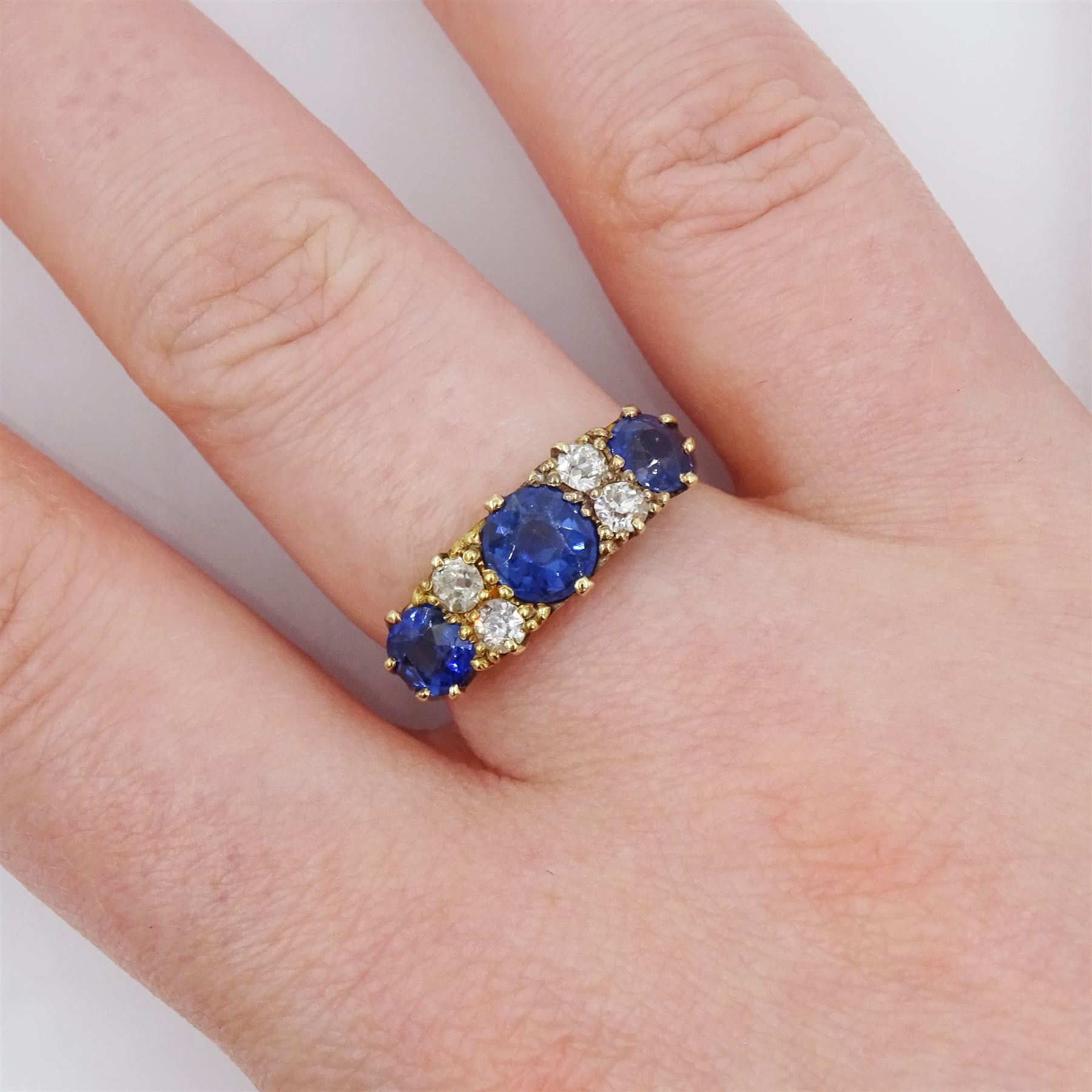 Early 20th century 18ct gold three stone cushion cut sapphire and four stone old cut diamond ring - Image 2 of 4