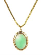 Gold oval jade pendant