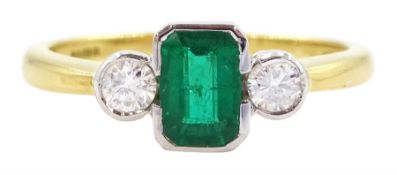 18ct gold three stone octagonal cut emerald and round brilliant cut diamond ring