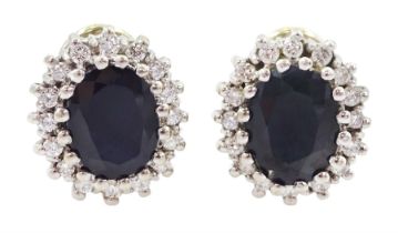 Pair of 14ct white gold oval cut sapphire and round brilliant cut diamond cluster stud earrings