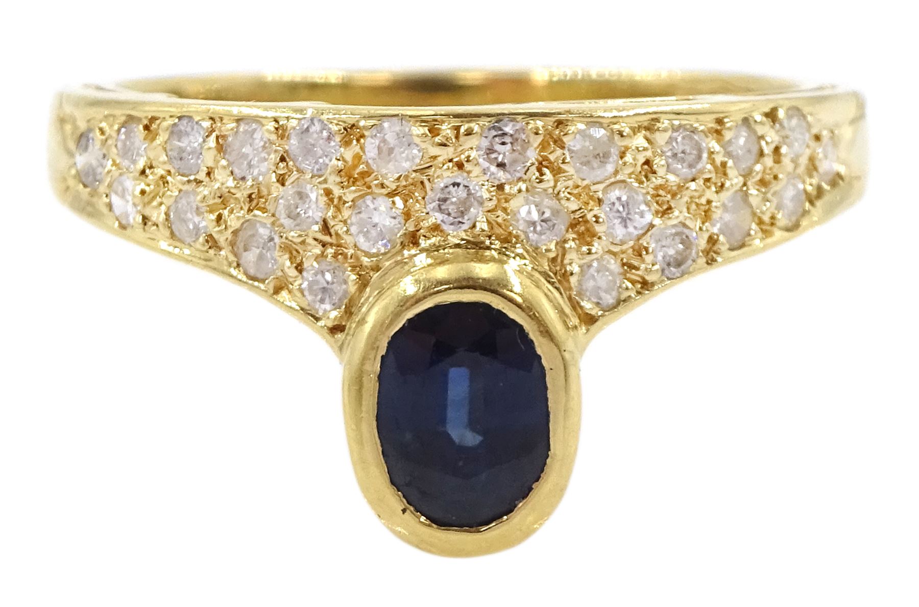 18ct gold oval cut sapphire and pave set round brilliant cut diamond ring