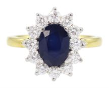 18ct gold oval cut sapphire and round brilliant cut diamond cluster ring