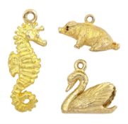 Three 9ct gold pendant / charms including sitting pig