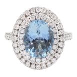 18ct white gold oval cut aquamarine and two row round brilliant cut diamond ring