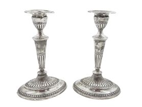 Pair of late Victorian silver mounted candlesticks