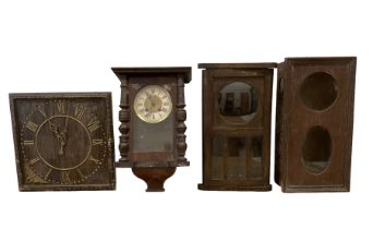 Two oak wall clock cases and two wall clocks