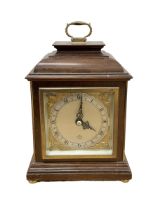 Elliott mantle clock in an 18th century bracket clock style case.