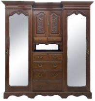 Late Victorian walnut reverse break-front triple wardrobe